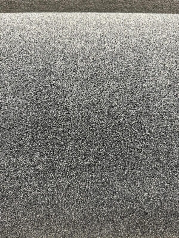 Close-up image of the Chiltern Twilight 4.5x4m. The texture appears granular, resembling a rough, sandpaper-like material. The image captures the fine details of the grit, showcasing a dense, consistent pattern across the entire surface.